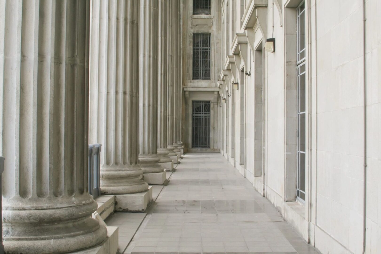 A Building Hallway With Ornate Pillars